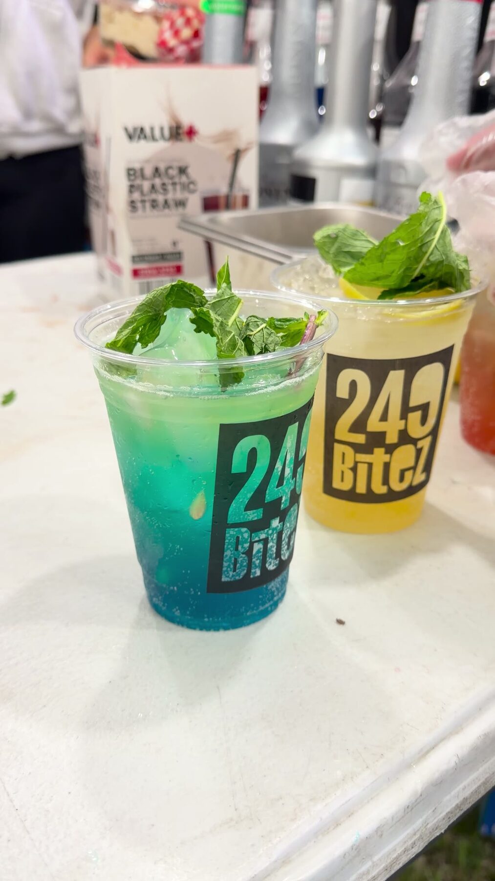 Branded 249 Bitez cups of fresh mocktail mojitos with mint and lemon.