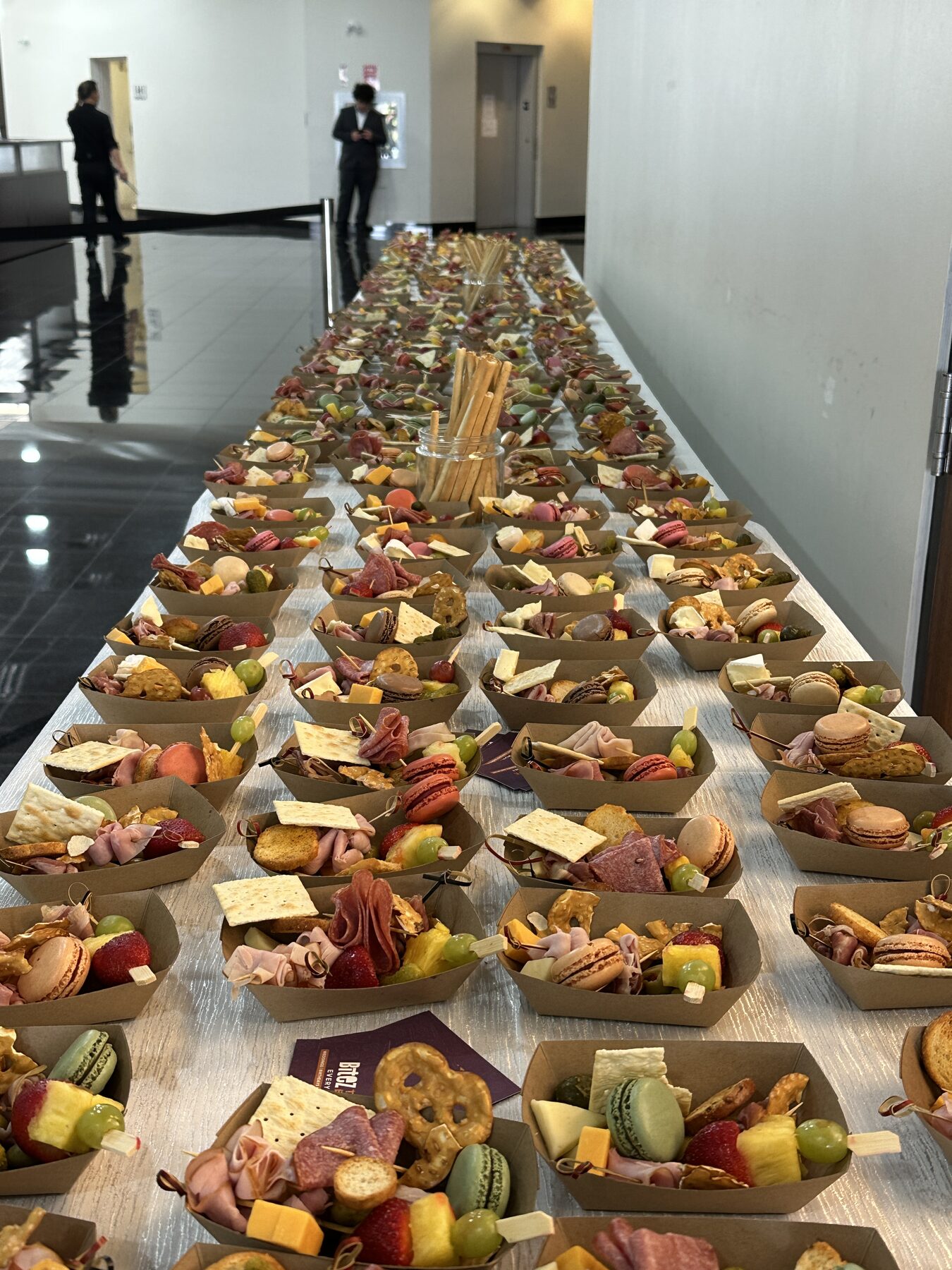 A full grazing table of individual charcuterie boats, styled by 249 Bitez.